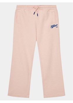 Tommy Hilfiger Spodnie dresowe Hilfiger Script Wide Sweatpant KG0KG07751 Różowy Regular Fit ze sklepu MODIVO w kategorii Spodnie dziewczęce - zdjęcie 181128903