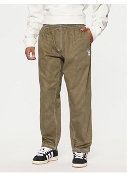 adidas Spodnie dresowe JP4488 Zielony Loose Fit ze sklepu MODIVO w kategorii Spodnie męskie - zdjęcie 181138121