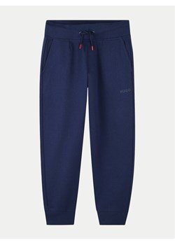 Hugo Spodnie dresowe G00175 M Niebieski Regular Fit ze sklepu MODIVO w kategorii Spodnie chłopięce - zdjęcie 181139721
