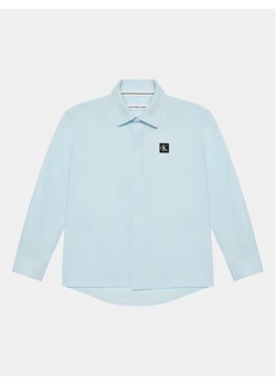 Calvin Klein Jeans Koszula Ceremony IB0IB01962 Błękitny Regular Fit ze sklepu MODIVO w kategorii Koszule chłopięce - zdjęcie 181141924