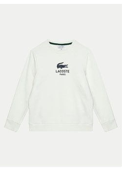 Lacoste Bluza SJ3005 Écru Regular Fit ze sklepu MODIVO w kategorii Bluzy chłopięce - zdjęcie 181143811