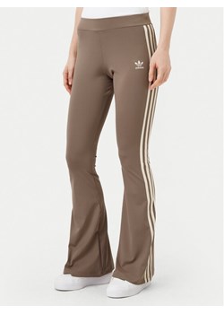 adidas Legginsy JD4601 Beżowy Flare Fit ze sklepu MODIVO w kategorii Spodnie damskie - zdjęcie 181147451