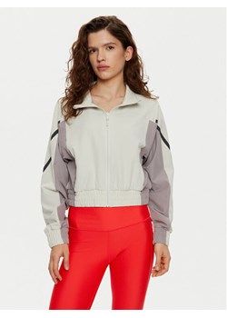 Under Armour Wiatrówka UA Unstoppable Crop 1386479 Écru Regular Fit ze sklepu MODIVO w kategorii Kurtki damskie - zdjęcie 181151214