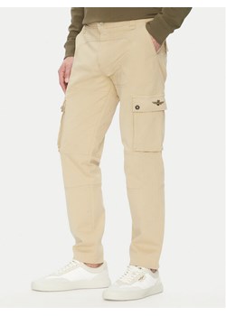 Aeronautica Militare Spodnie materiałowe 251PA1665CT3534 Beżowy Regular Fit ze sklepu MODIVO w kategorii Spodenki męskie - zdjęcie 181152051
