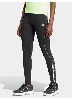 adidas Legginsy Graphic IT9700 Czarny Slim Fit ze sklepu MODIVO w kategorii Spodnie damskie - zdjęcie 181153131