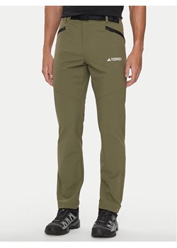 adidas Spodnie outdoor Terrex Xperior IK3533 Khaki Regular Fit ze sklepu MODIVO w kategorii Spodnie męskie - zdjęcie 181154834