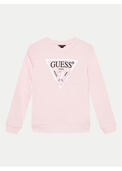 Guess Bluzka J74Q10 KAUG0 Różowy Regular Fit ze sklepu MODIVO w kategorii Bluzki dziewczęce - zdjęcie 181156864