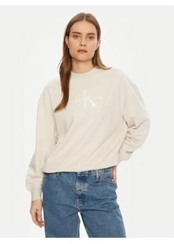 Calvin Klein Jeans Bluza Glossy Monologo J20J224724 Beżowy Regular Fit ze sklepu MODIVO w kategorii Bluzy damskie - zdjęcie 181159774