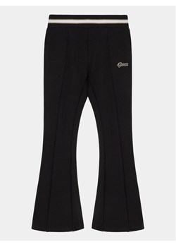 Guess Spodnie materiałowe J4RB00 KAUH0 Czarny Regular Fit ze sklepu MODIVO w kategorii Spodnie dziewczęce - zdjęcie 181159873