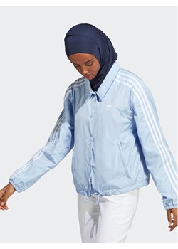 adidas Kurtka przejściowa Adicolor Classics 3-Stripes Coach Jacket IC5480 Błękitny Loose Fit ze sklepu MODIVO w kategorii Kurtki damskie - zdjęcie 181161343