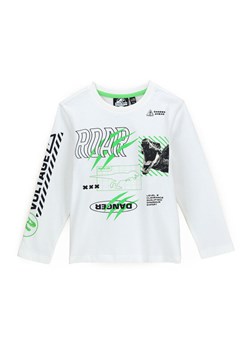 Original Marines Bluzka JURASSIC WORLD DCAV2627B Biały Regular Fit - id: 0000301640486 - marki Original Marines - 181162312 Original Marines Bluzka JURASSIC WORLD DCAV2627B Biały Regular Fit ze sklepu MODIVO w kategorii T-shirty chłopięce - zdjęcie 181162312