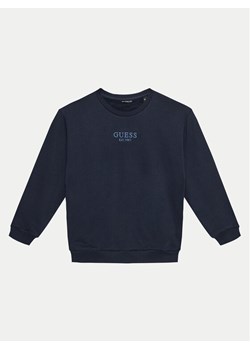 Guess Bluza L4BQ28 KAV33 Granatowy Regular Fit ze sklepu MODIVO w kategorii Bluzy chłopięce - zdjęcie 181169381