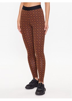 Guess Legginsy V3YB01 MC04N Brązowy Slim Fit ze sklepu MODIVO w kategorii Spodnie damskie - zdjęcie 181169982