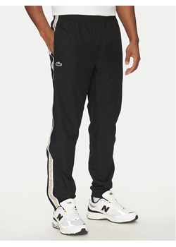 Lacoste Spodnie dresowe XH8974 Czarny Relaxed Fit ze sklepu MODIVO w kategorii Spodnie męskie - zdjęcie 181170043
