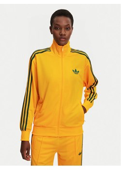 adidas Bluza adicolor Classic Firebird JP2300 Żółty Loose Fit ze sklepu MODIVO w kategorii Bluzy damskie - zdjęcie 181171361