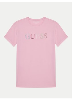 Guess T-Shirt J5GI38 J1314 Różowy Regular Fit ze sklepu MODIVO w kategorii Bluzki dziewczęce - zdjęcie 181173912