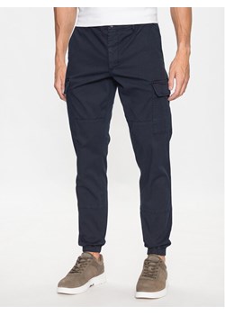 Tommy Hilfiger Joggery Chelsea MW0MW31149 Granatowy Relaxed Fit ze sklepu MODIVO w kategorii Spodnie męskie - zdjęcie 181175120
