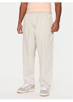 adidas Spodnie dresowe Wabash JD0673 Beżowy Loose Fit ze sklepu MODIVO w kategorii Spodnie męskie - zdjęcie 181175243