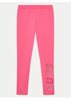 Guess Legginsy J4GB10 J1314 Różowy Slim Fit ze sklepu MODIVO w kategorii Spodnie dziewczęce - zdjęcie 181175782