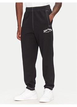 adidas Spodnie dresowe JP4487 Czarny Regular Fit ze sklepu MODIVO w kategorii Spodnie męskie - zdjęcie 181179622