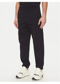 Armani Exchange Spodnie dresowe XM000354 AF10818 UB101 Granatowy Regular Fit - id: 0000305117861 - marki Armani Exchange - 181180994 Armani Exchange Spodnie dresowe XM000354 AF10818 UB101 Granatowy Regular Fit ze sklepu MODIVO w kategorii Spodnie męskie - zdjęcie 181180994