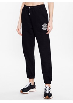 Ellesse Spodnie dresowe Jigono SGR17954 Czarny Regular Fit ze sklepu MODIVO w kategorii Spodnie damskie - zdjęcie 181182614