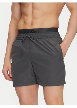Calvin Klein Swimwear Szorty kąpielowe KM0KM01104 Szary Regular Fit ze sklepu MODIVO w kategorii Kąpielówki - zdjęcie 181184594