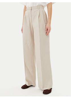 Tommy Hilfiger Spodnie materiałowe WW0WW45460 Beżowy Relaxed Fit ze sklepu MODIVO w kategorii Spodnie damskie - zdjęcie 181185302