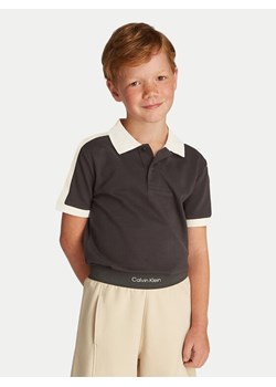Calvin Klein Jeans Polo IB0IB02485 Czarny Regular Fit ze sklepu MODIVO w kategorii T-shirty chłopięce - zdjęcie 181185394