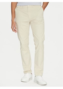 Calvin Klein Chinosy Modern Twill K10K113696 Beżowy Slim Fit ze sklepu MODIVO w kategorii Spodnie męskie - zdjęcie 181186613