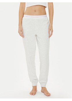 Calvin Klein Underwear Spodnie dresowe 000QS6872E Różowy Relaxed Fit ze sklepu MODIVO w kategorii Spodnie damskie - zdjęcie 181190561