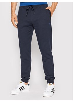 Guess Spodnie dresowe Z2YB22 KAIJ1 Granatowy Regular Fit ze sklepu MODIVO w kategorii Spodnie męskie - zdjęcie 181192592