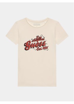 Guess T-Shirt J3BI03 J1314 Écru Regular Fit ze sklepu MODIVO w kategorii T-shirty chłopięce - zdjęcie 181193692