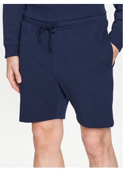 Tommy Jeans Szorty sportowe College DM0DM16331 Granatowy Regular Fit ze sklepu MODIVO w kategorii Spodenki męskie - zdjęcie 181194073