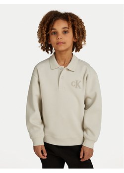 Calvin Klein Jeans Bluza IB0IB02231 Beżowy Regular Fit ze sklepu MODIVO w kategorii Bluzy chłopięce - zdjęcie 181196150