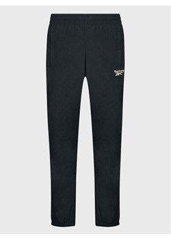 Reebok Spodnie dresowe Vector HK7077 Czarny Slim Fit ze sklepu MODIVO w kategorii Spodnie męskie - zdjęcie 181196383