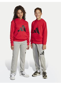 adidas Spodnie dresowe Essentials JD2092 Szary Regular Fit ze sklepu MODIVO w kategorii Spodnie chłopięce - zdjęcie 181196881