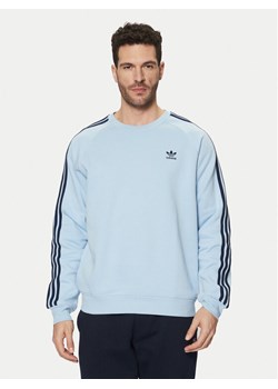 adidas Bluza adicolor Classics 3-Stripes JN7026 Błękitny Regular Fit ze sklepu MODIVO w kategorii Bluzy męskie - zdjęcie 181197094