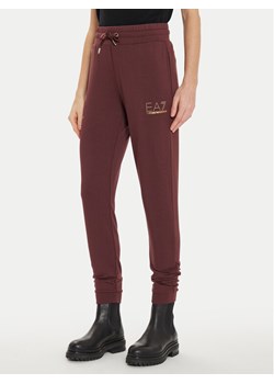 EA7 Emporio Armani Spodnie dresowe 8NTP66 TJ9RZ 1755 Brązowy Regular Fit ze sklepu MODIVO w kategorii Spodnie damskie - zdjęcie 181198514