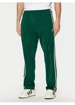 adidas Spodnie dresowe adicolor Classics Firebird JP2539 Zielony Regular Fit ze sklepu MODIVO w kategorii Spodnie męskie - zdjęcie 181200872