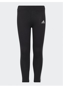 adidas Legginsy Essentials 3-Stripes Leggings H65800 Czarny Fitted Fit ze sklepu MODIVO w kategorii Spodnie dziewczęce - zdjęcie 181201020