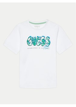 Guess T-Shirt L4YI20 K8HM4 Biały Regular Fit ze sklepu MODIVO w kategorii T-shirty chłopięce - zdjęcie 181203260