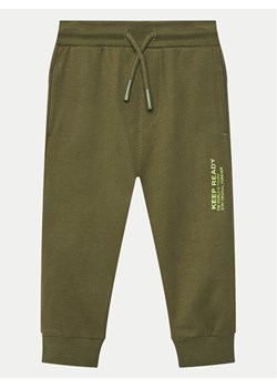 Coccodrillo Spodnie dresowe WC5120101VBA Zielony Regular Fit ze sklepu MODIVO w kategorii Spodnie chłopięce - zdjęcie 181203884