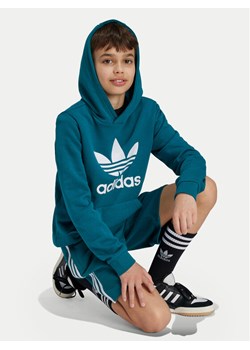 adidas Bluza Trefoil IY7440 Turkusowy Regular Fit ze sklepu MODIVO w kategorii Bluzy chłopięce - zdjęcie 181206604
