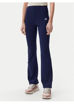 adidas Legginsy Essentials Small Logo JD3073 Granatowy Flare Fit ze sklepu MODIVO w kategorii Spodnie damskie - zdjęcie 181207302
