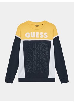 Guess Bluza N3BQ02 KAX73 Granatowy Regular Fit ze sklepu MODIVO w kategorii Bluzy chłopięce - zdjęcie 181208080