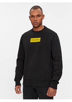 Calvin Klein Bluza Raised K10K112252 Czarny Regular Fit ze sklepu MODIVO w kategorii Bluzy męskie - zdjęcie 181238054