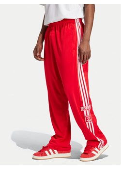 adidas Spodnie dresowe Adibreak IY9924 Czerwony Loose Fit ze sklepu MODIVO w kategorii Spodnie męskie - zdjęcie 181243953