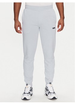Puma Spodnie dresowe Ess 684714 Błękitny Regular Fit ze sklepu MODIVO w kategorii Spodnie męskie - zdjęcie 181244643