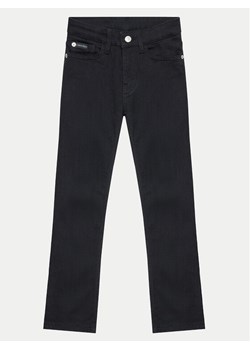 Calvin Klein Jeans Jeansy Essential IB0IB02187 Czarny Slim Fit ze sklepu MODIVO w kategorii Spodnie dziewczęce - zdjęcie 182594330